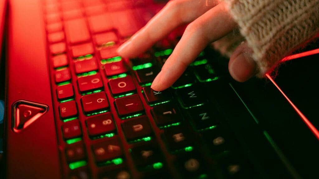 A Person Typing on a Keyboard