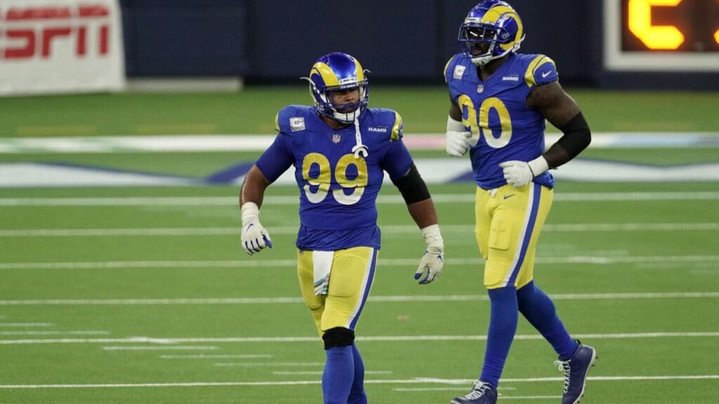 Oct 26, 2020; Inglewood, California, USA; Los Angeles Rams defensive end Aaron Donald (99) and defensive end Michael Brockers (90) celebrate in the final minute against the Chicago Bears at SoFi Stadium. The Rams defeated the Bears 24-10.