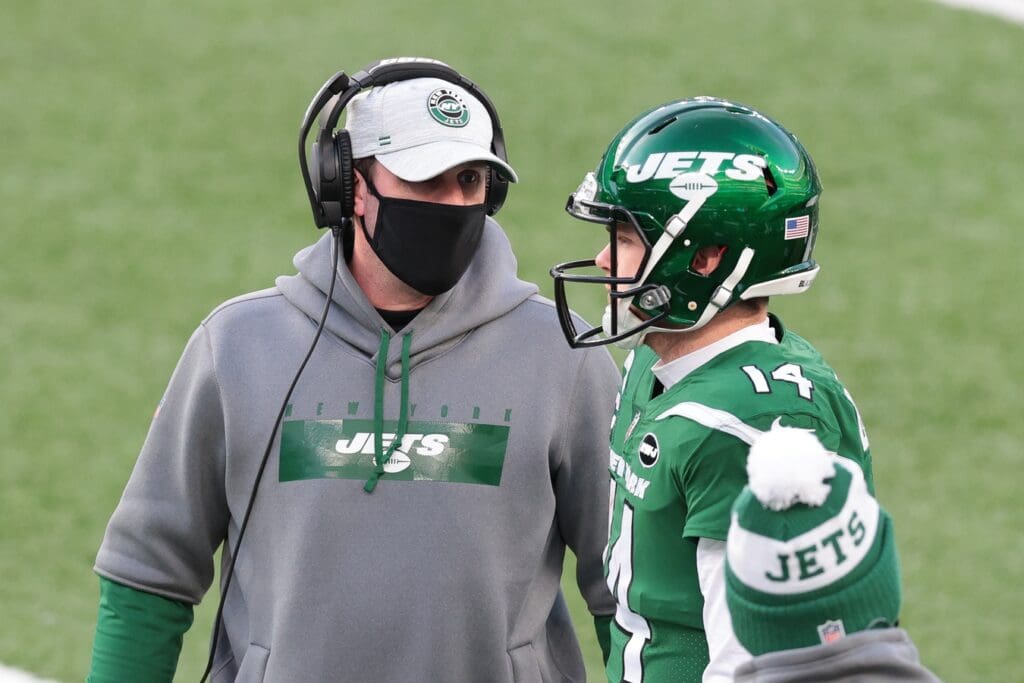 Dec 27, 2020; East Rutherford, New Jersey, USA; New York Jets head coach Adam Gase talks with quarterback Sam Darnold (14) during the second half against the Cleveland Browns at MetLife Stadium.