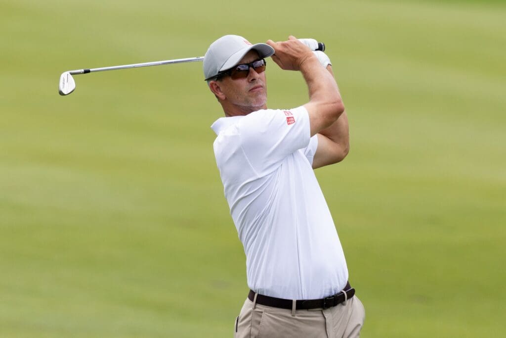 Jun 21, 2025; Cromwell, Connecticut, USA; Adam Scott plays his approach shot on the 18th hole during the third round of the Travelers Championship golf tournament.