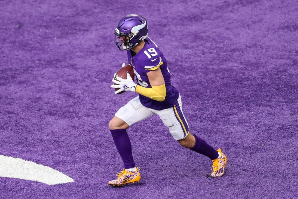 Dec 20, 2020; Minneapolis, Minnesota, USA; Minnesota Vikings wide receiver Adam Thielen (19) catches a touchdown pass during the first quarter against the Chicago Bears at U.S. Bank Stadium.