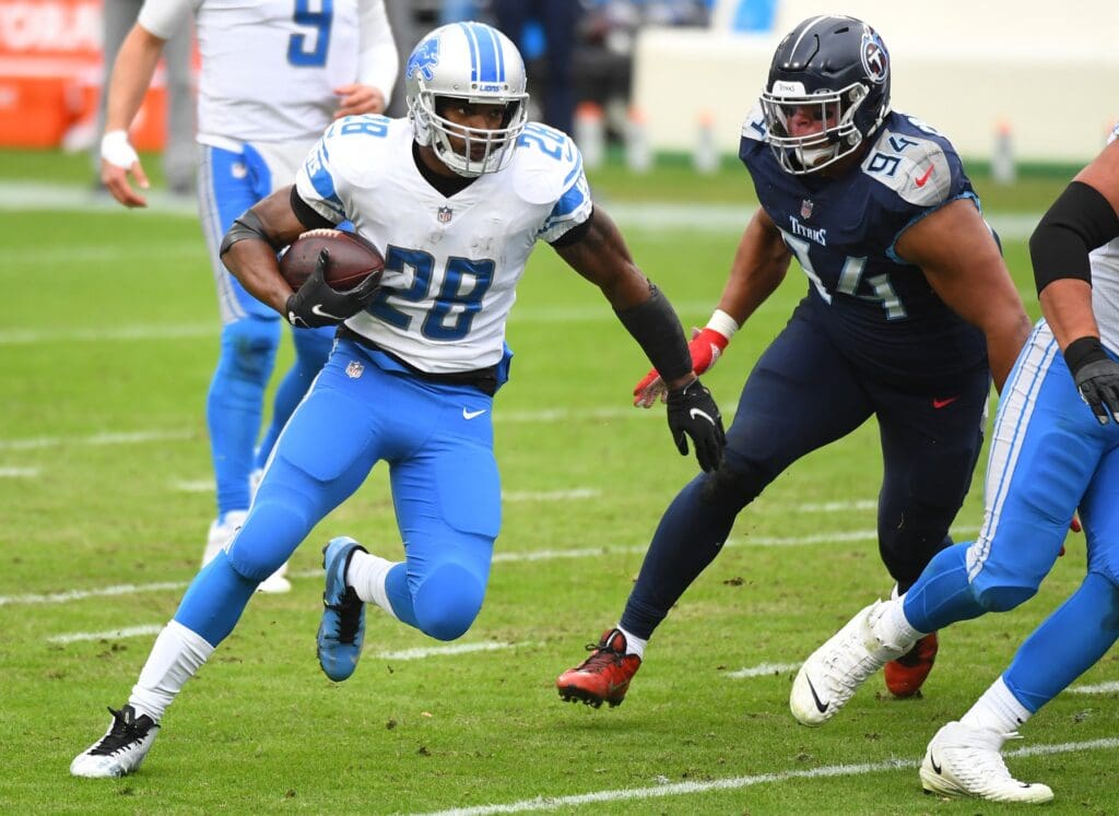 Dec 20, 2020; Nashville, Tennessee, USA; Detroit Lions running back Adrian Peterson (28) runs for a short gain against the Tennessee Titans during the first half at Nissan Stadium.