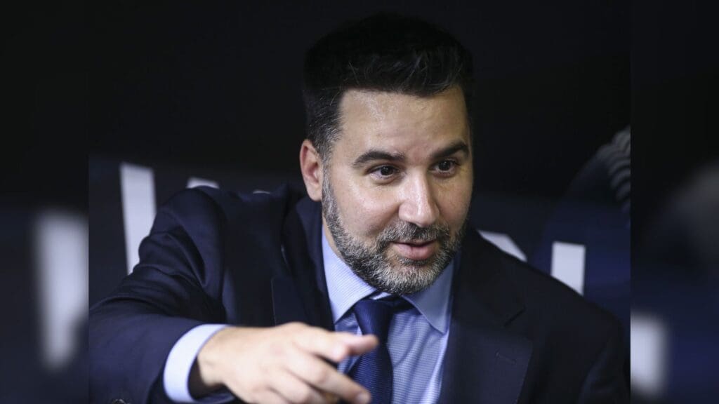 Oct 25, 2021; Houston, Texas, USA; Atlanta Braves general manager Alex Anthopoulos talks in the dugout during workouts before Game 1 of the World Series between the Houston Astros and the Atlanta Braves at Minute Maid Park.