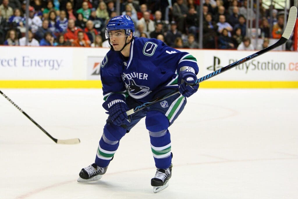 Jan 28, 2009; Vancouver, BC, Canada; Vancouver Canucks left wing Alex Burrows (14) forechecks against the Nashville Predators at General Motors Place in Vancouver, BC. The Thrashers beat the Canucks 5-3.