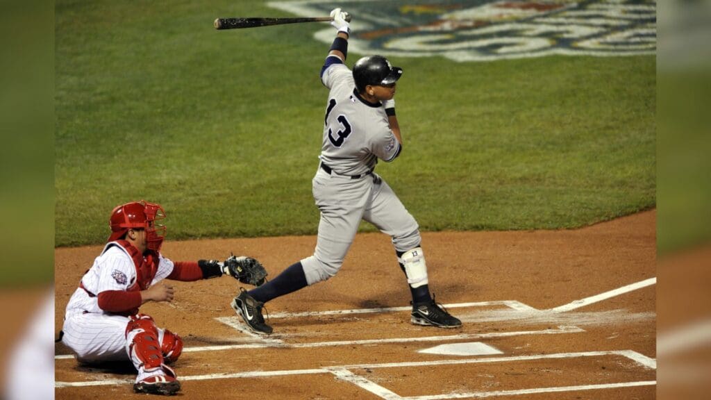 Nov 2, 2009; Philadelphia, PA, USA; New York Yankees third baseman Alex Rodriguez (13) hits an RBI double during the first inning of game five of the 2009 World Series against the Philadelphia Phillies at Citizens Bank Park.