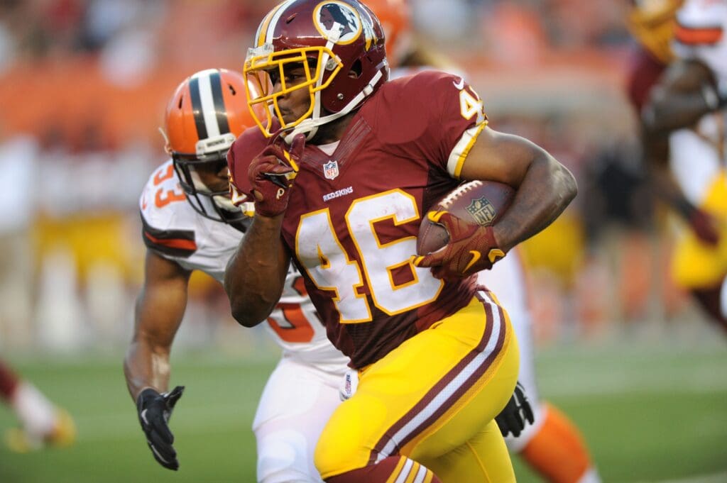 Aug 13, 2015; Cleveland, OH, USA; Washington Redskins running back Alfred Morris (46) runs the ball during the first quarter against the Cleveland Browns in a preseason NFL football game at FirstEnergy Stadium