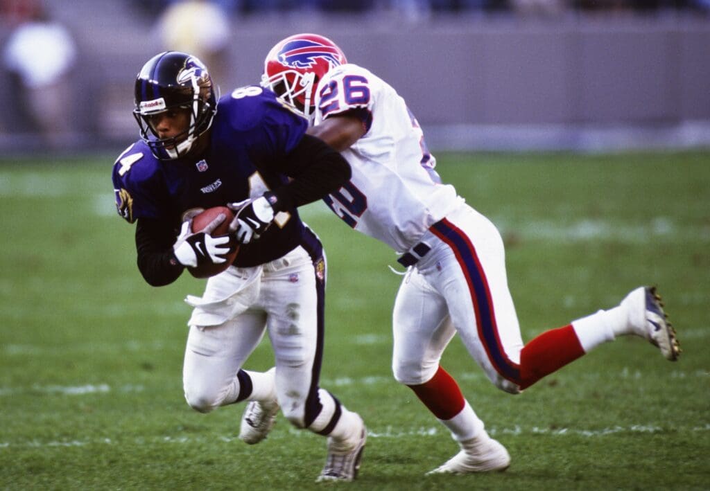 Oct 31, 1999; Baltimore, MD, USA; FILE PHOTO; Baltimore Ravens receiver Jermaine Lewis (84) in action against Buffalo Bills defensive back Antoine Winfield (26) at PSINet Stadium.