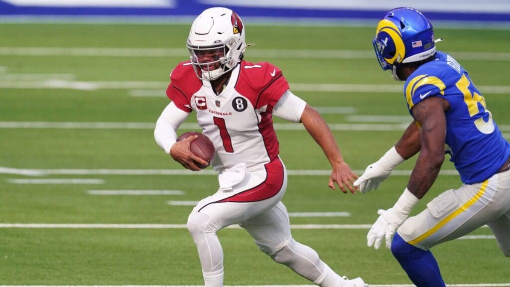Jan 3, 2021; Inglewood, California, USA; Arizona Cardinals quarterback Kyler Murray (1) is pursued by Los Angeles Rams outside linebacker Leonard Floyd (54) in the first quarter at SoFi Stadium. The Rams defeated the Cardinals 18-7.