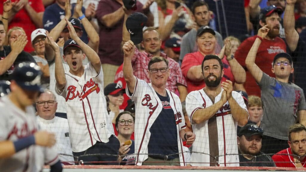 Jul 1, 2022; Cincinnati, Ohio, USA; Atlanta Braves fans cheer after shortstop Dansby Swanson (not pictured) hits a three-run home run against the Cincinnati Reds in the seventh inning at Great American Ball Park.
