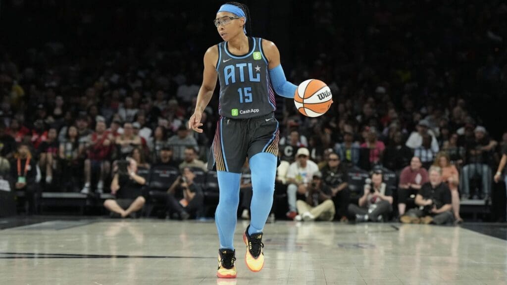 Jul 22, 2025; Las Vegas, Nevada, USA; Atlanta Dream guard Allisha Gray (15) dribbles the ball against the Las Vegas Aces in the third quarter of their game at Michelob Ultra Arena.