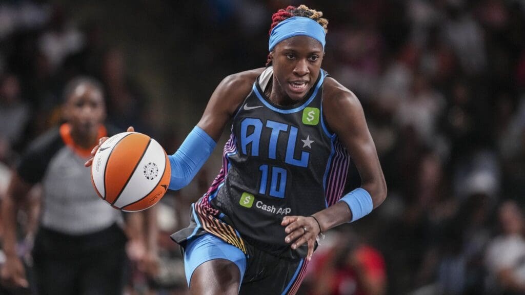 Jun 27, 2025; College Park, Georgia, USA; Atlanta Dream guard Rhyne Howard (10) brings the ball up the court against the Minnesota Lynx during the first half at Gateway Center Arena at College Park.