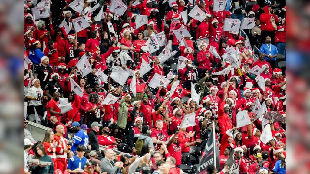 Atlanta Falcons fans celebrate after a touchdown run by Atlanta Falcons running back Tyler Allgeier (25) on Sunday, Dec. 24, 2023, during a game against the Indianapolis Colts at Mercedes-Benz Stadium in Atlanta.