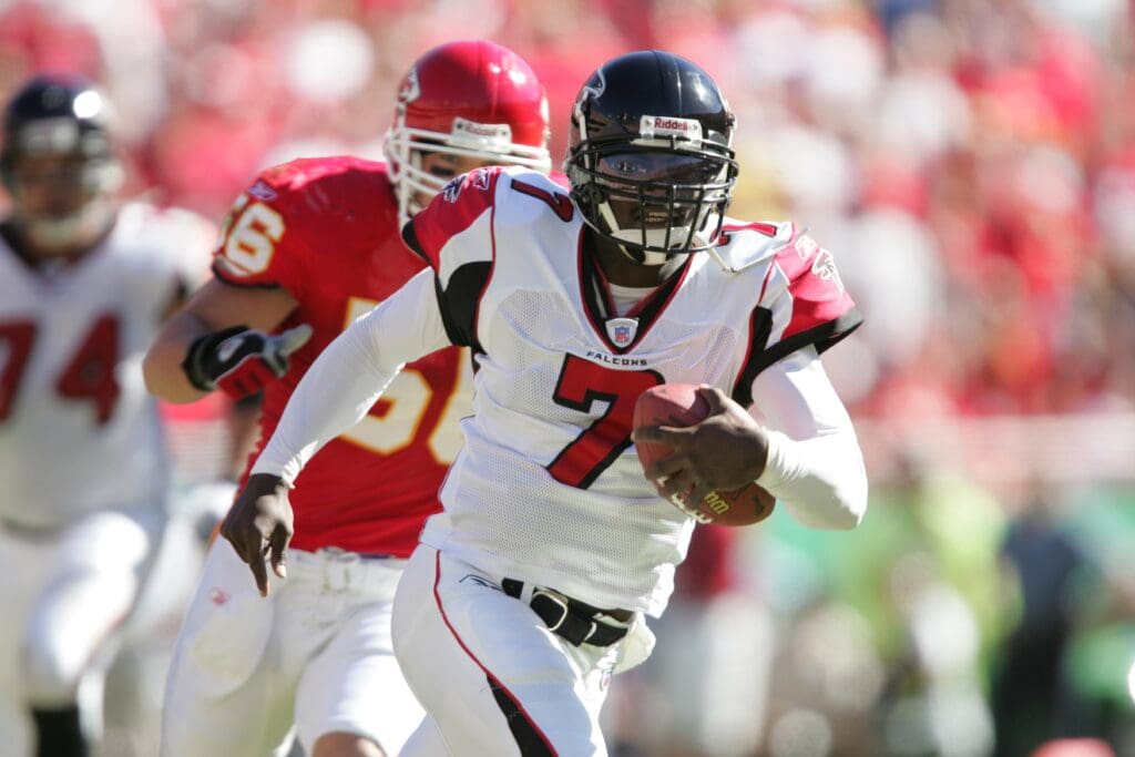 Oct 24, 2004; Kansas City, MO, USA; Atlanta Falcons quarterback #7 Michael Vick is pressured by Kansas City Chiefs linebacker #56 Monty Beisel in 1st half action at Arrowhead Stadium.