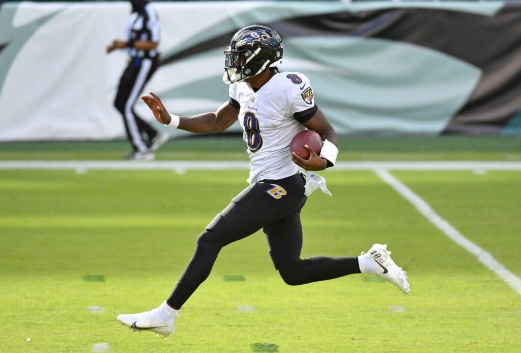 Oct 18, 2020; Philadelphia, Pennsylvania, USA; Baltimore Ravens quarterback Lamar Jackson (8) celebrates as he scores on a 37-yard touchdown run against the Philadelphia Eagles during the third quarter at Lincoln Financial Field.