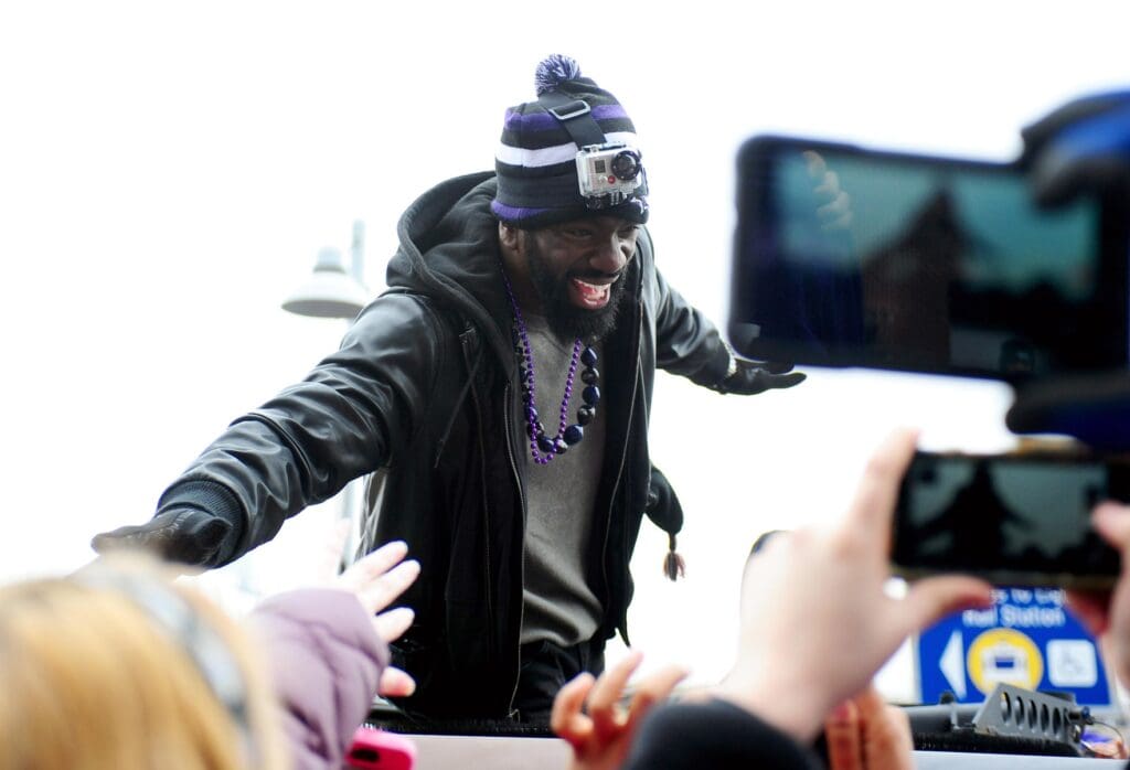 Feb 5, 2013; Baltimore, MD, USA; Baltimore Ravens safety Ed Reed (20) high fives fans during the Super Bowl XLVII victory parade at M&T Bank Stadium.