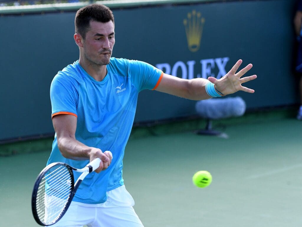 Mar 5, 2019; Indian Wells, CA, USA; Bernard Tomic (AUS) hits a shot during his first round qualifying match against Lucas Rosol (not pictured) in the BNP Paribas Open at the Indian Wells Tennis Garden.