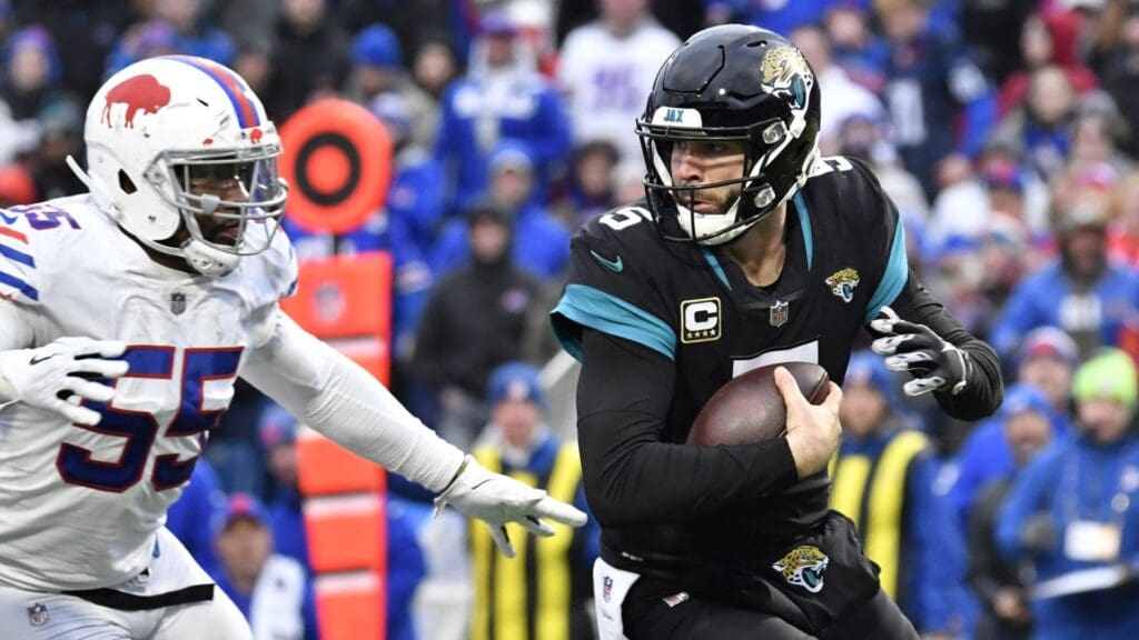 Nov 25, 2018; Orchard Park, NY, USA; Jacksonville Jaguars quarterback Blake Bortles (5) is sacked by Buffalo Bills defensive end Jerry Hughes (55) during the fourth quarter at New Era Field.