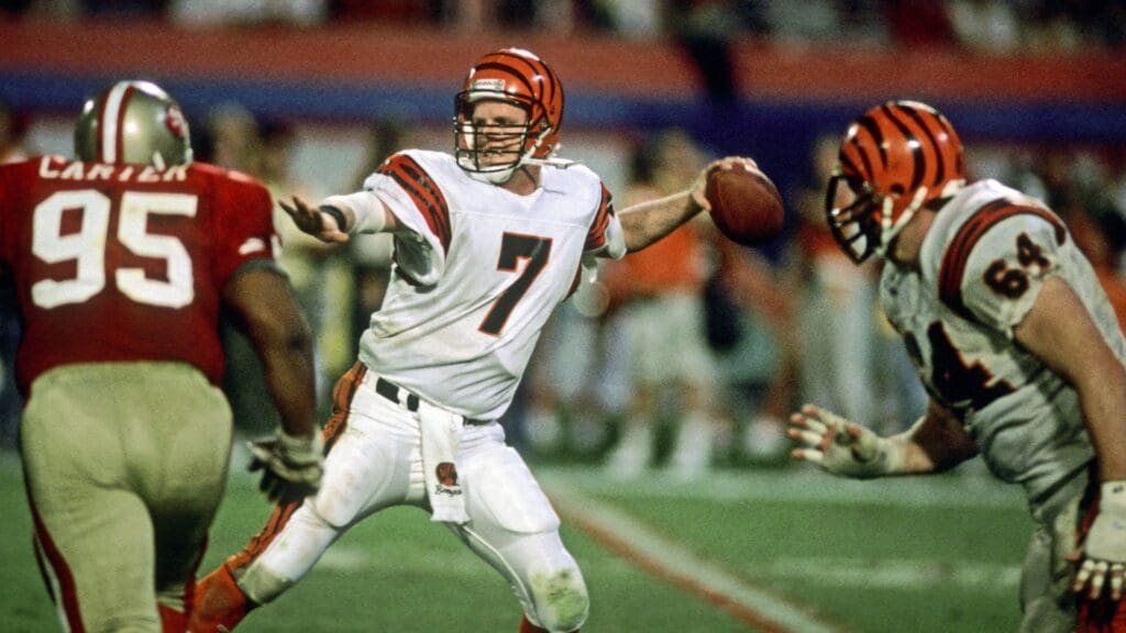 Jan 22, 1989; Miami, FL, USA; FILE PHOTO; Cincinnati Bengals quarterback (7) Boomer Esiason sets to throw as San Francisco 49ers defensive tackle (95) Michael Carter pressures him during Super Bowl XXIII at Joe Robbie Stadium. The 49ers defeated the Bengals 20-16.