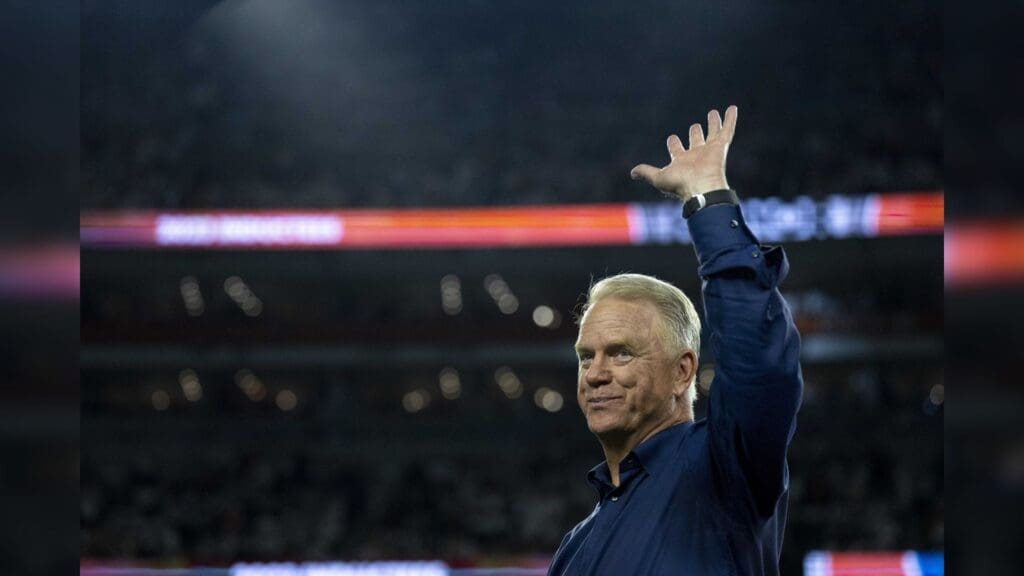 Sep 25, 2023; Cincinnati, Ohio, USA; Boomer Esiason, former Cincinnati Bengals quarterback, waives before being announced at halftime as a Bengals Ring of Champions inductee at halftime of the NFL game between the Cincinnati Bengals and Los Angeles Rams at Paycor Stadium.