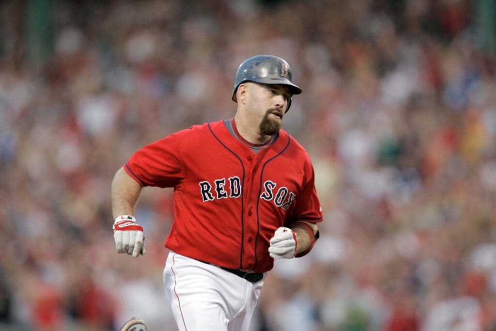 uly 12, 2008; Boston, MA, USA; Boston Red Sox first baseman Kevin Youkilis (20) hits a grand slam in the third inning against the Baltimore Orioles at Fenway Park.