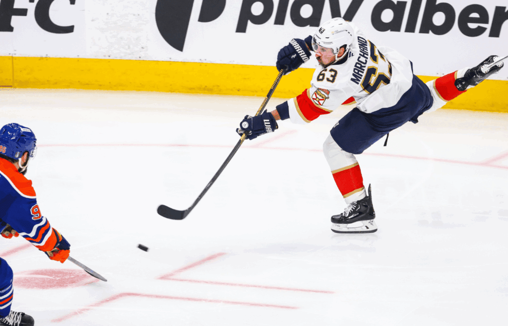 Jun 14, 2025; Edmonton, Alberta, CAN; Florida Panthers center Brad Marchand (63) shoots the puck against the Edmonton Oilers during the second period in game five of the 2025 Stanley Cup Final at Rogers Place.