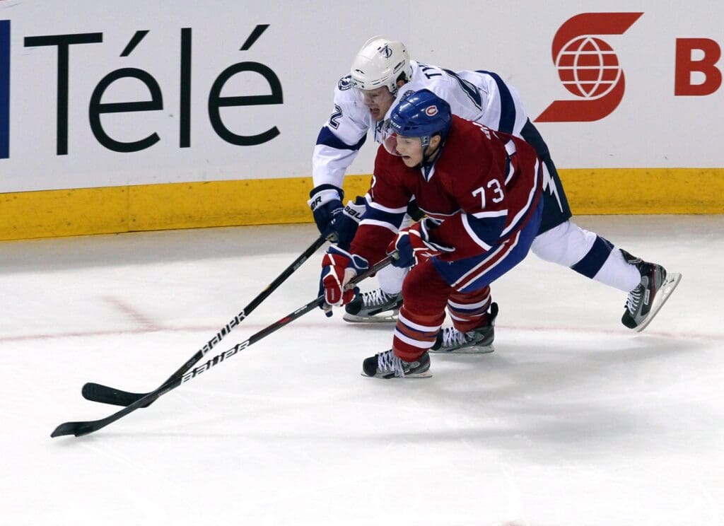 Sep 29, 2011; Montreal, QC, CAN; Montreal Canadiens right wing Brendan Gallagher (73) and Tampa Bay Lightning center Dana Tyrell (42) battle for the puck during the first period at the Bell Center.