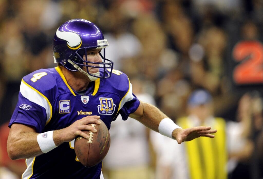 September 9, 2010; New Orleans, LA, USA; Minnesota Vikings quarterback Brett Favre (4) rolls out to pass against the New Orleans Saints during the first half at the Louisiana Superdome. 