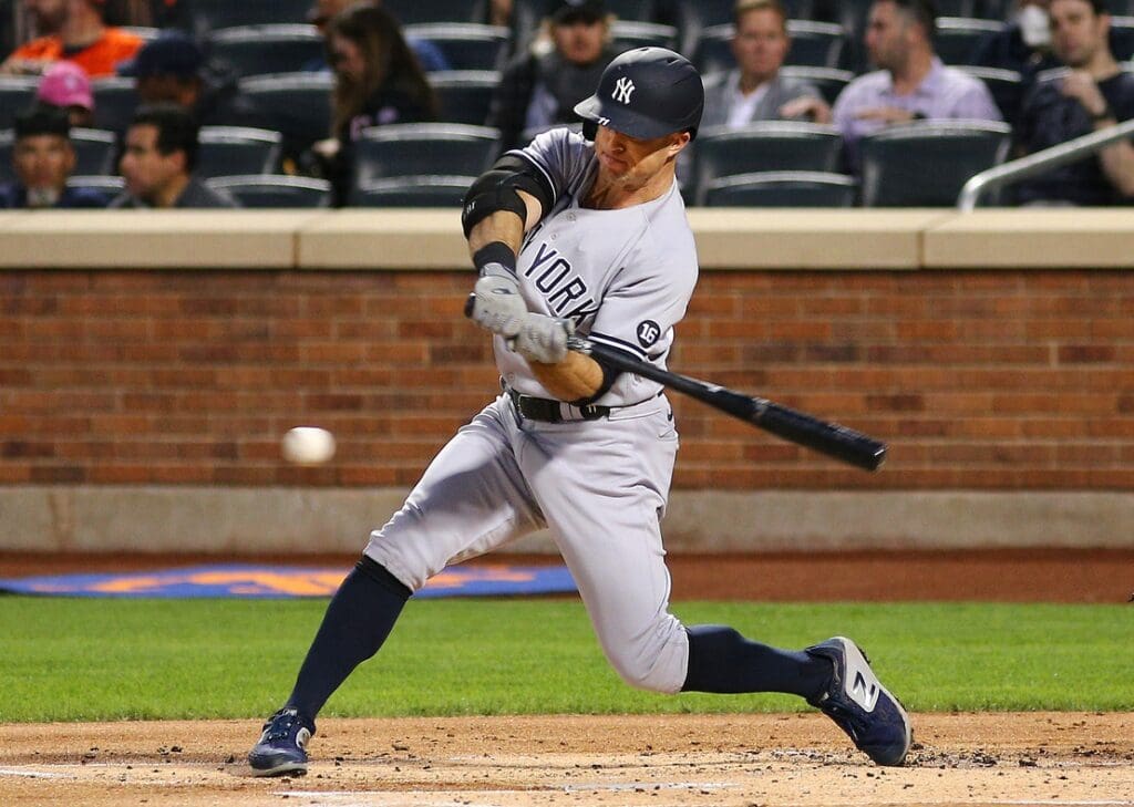 Sep 10, 2021; New York City, New York, USA; New York Yankees center fielder Brett Gardner (11) triples against the New York Mets during the first inning at Citi Field.