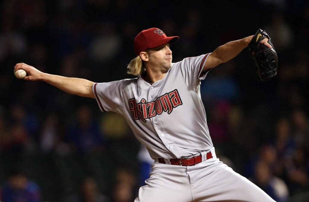 Apr 21, 2014; Chicago, IL, USA; Arizona Diamondbacks starting pitcher Bronson Arroyo throws a pitch against the Chicago Cubs during the first inning at Wrigley Field.