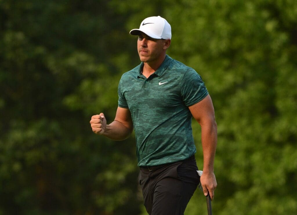 Aug 12, 2018; Saint Louis, MO, USA; Brooks Koepka celebrates on the 18th green after winning the PGA Championship golf tournament at Bellerive Country Club.