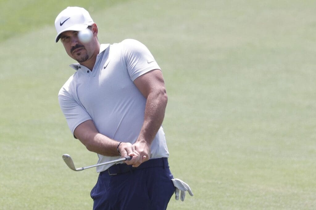 May 19, 2021; Kiawah Island, South Carolina, USA; Brooks Koepka pitches onto the fifteenth green during a practice round for the PGA Championship golf tournament at Ocean Course at Kiawah Island Resort.