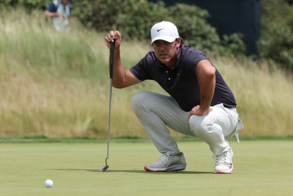 Jun 14, 2025; Oakmont, Pennsylvania, USA; Brooks Koepka prepares to putt on the second green during the third round of the U.S. Open golf tournament.