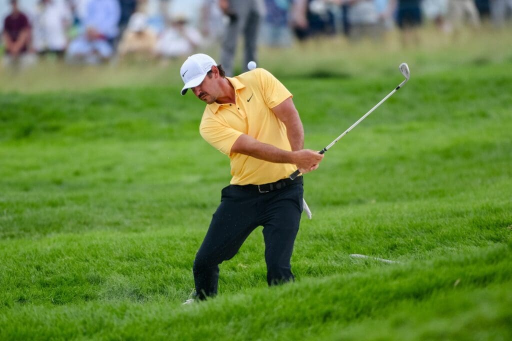 Brooks Koepka hits his ball out of the rough during the second round of the 125th U.S. Open at Oakmont Country Club in Oakmont, Pa. on June 13, 2025.