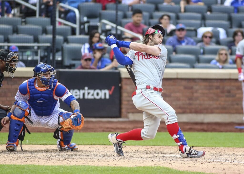 Sep 8, 2019; New York City, NY, USA; Philadelphia Phillies pinch hitter Bryce Harper (3) almost loses his helmet on a swinging strike in the seventh inning against the New York Mets at Citi Field