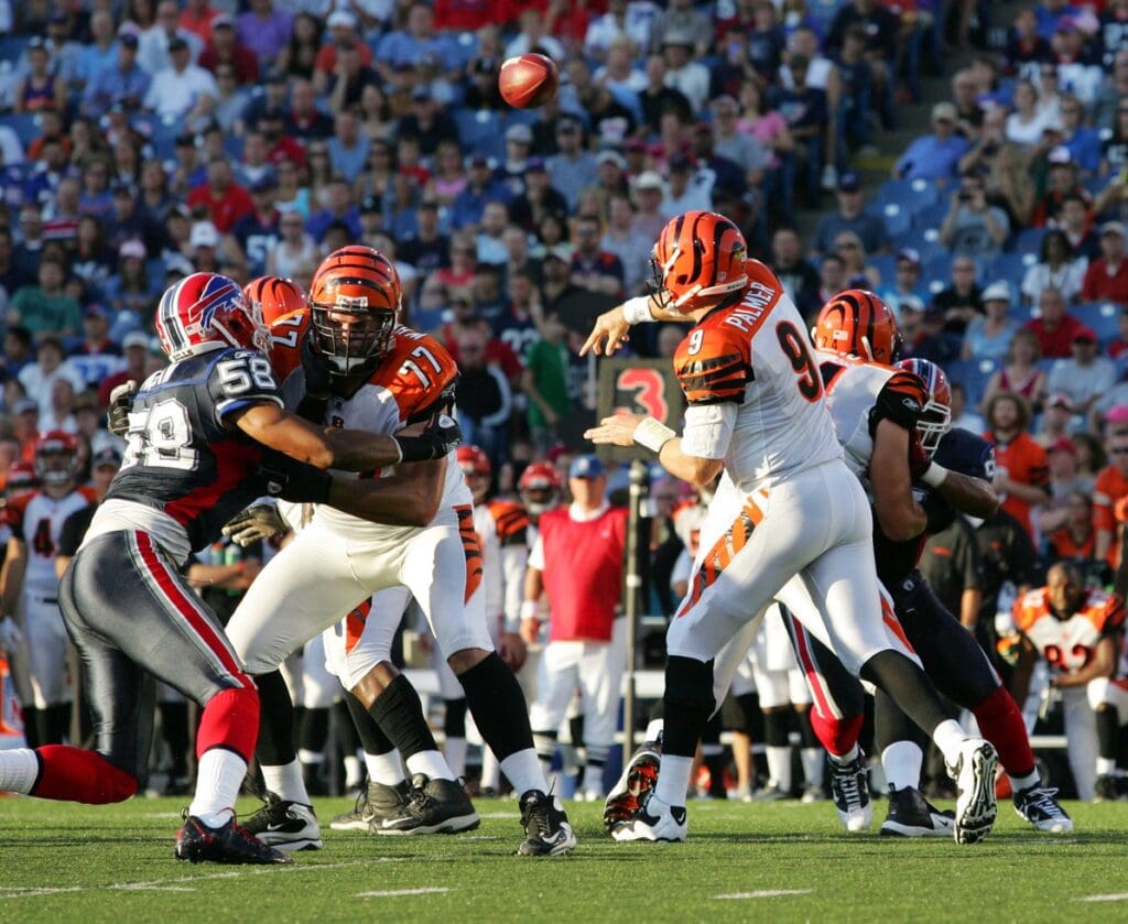 Aug 28, 2010; Orchard Park, NY, USA; Buffalo Bills linebacker Aaron Maybin (58) is blocked by Cincinnati Bengals offensive tackle Andrew Whitworth (77) as quarterback Carson Palmer (9) passes in Ralph Wilson Stadium. 