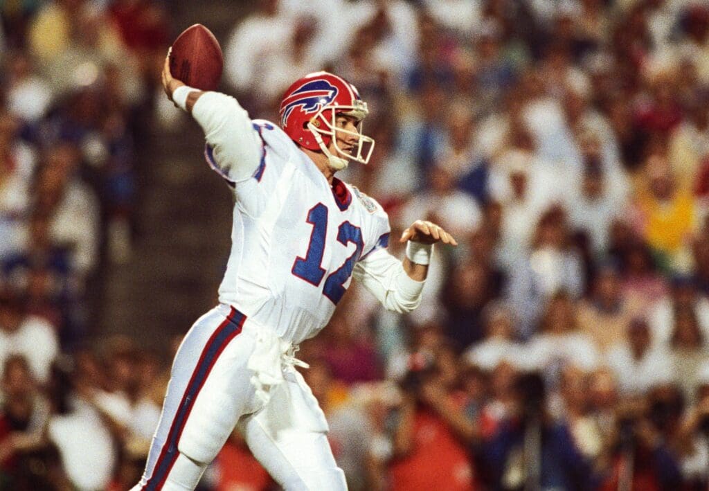 Jan 27, 1991; Tampa, FL, USA; FILE PHOTO; Buffalo Bills quarterback Jim Kelly (12) passes the ball against the New York Giants during Super Bowl XXV at Tampa Stadium. The Giants defeated the Bills 19-20.