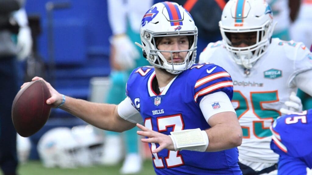 Jan 3, 2021; Orchard Park, New York, USA; Buffalo Bills quarterback Josh Allen (17) throws a pass against the Miami Dolphins in the first quarter at Bills Stadium.