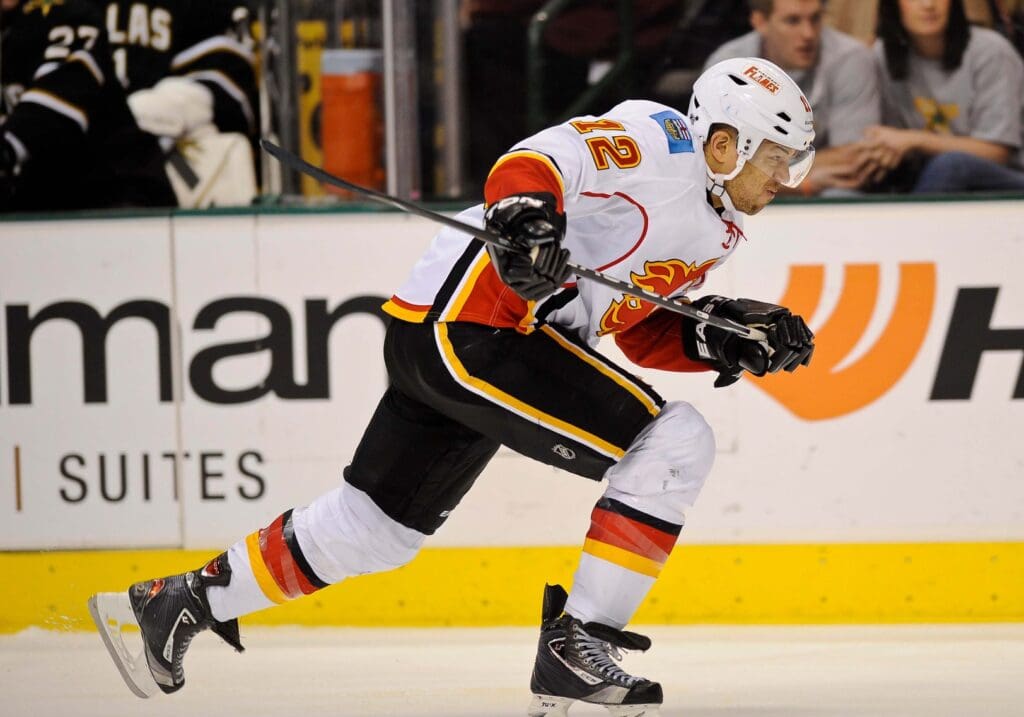 Mar 24, 2012; Dallas, TX, USA; Calgary Flames right wing Jarome Iginla (12) skates through the Dallas Stars zone during the game at the American Airlines Center. The Stars defeated the Flames 4-1.