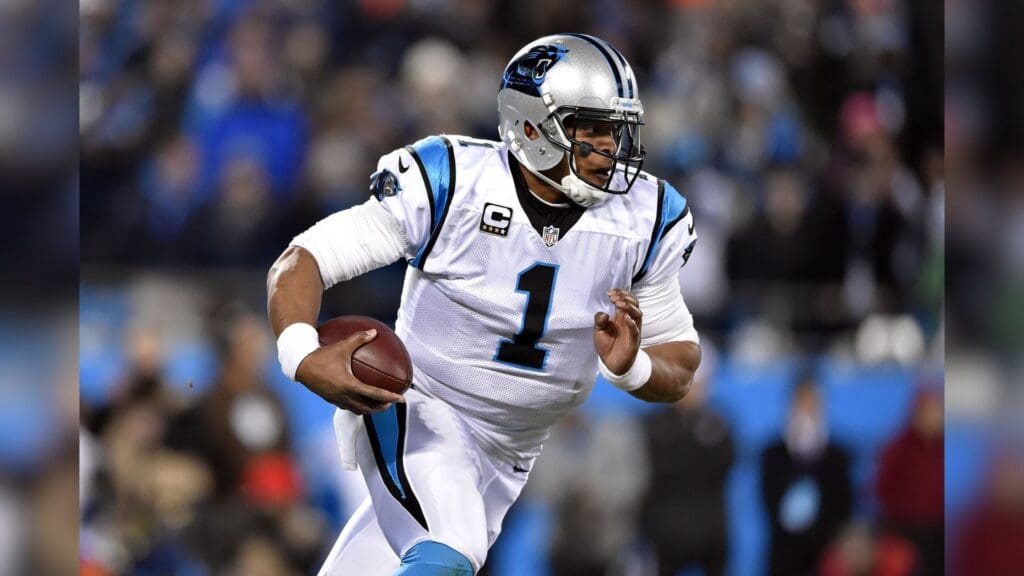 Jan 24, 2016; Charlotte, NC, USA; Carolina Panthers quarterback Cam Newton (1) runs with the ball during the second quarter against the Arizona Cardinals in the NFC Championship football game at Bank of America Stadium.