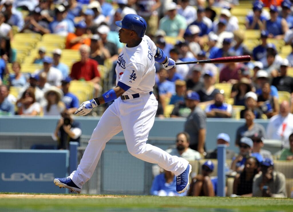 August 10, 2013; Los Angeles, CA, USA; Los Angeles Dodgers left fielder Carl Crawford (25) hits a double during the third inning against the Tampa Bay Rays at Dodger Stadium.