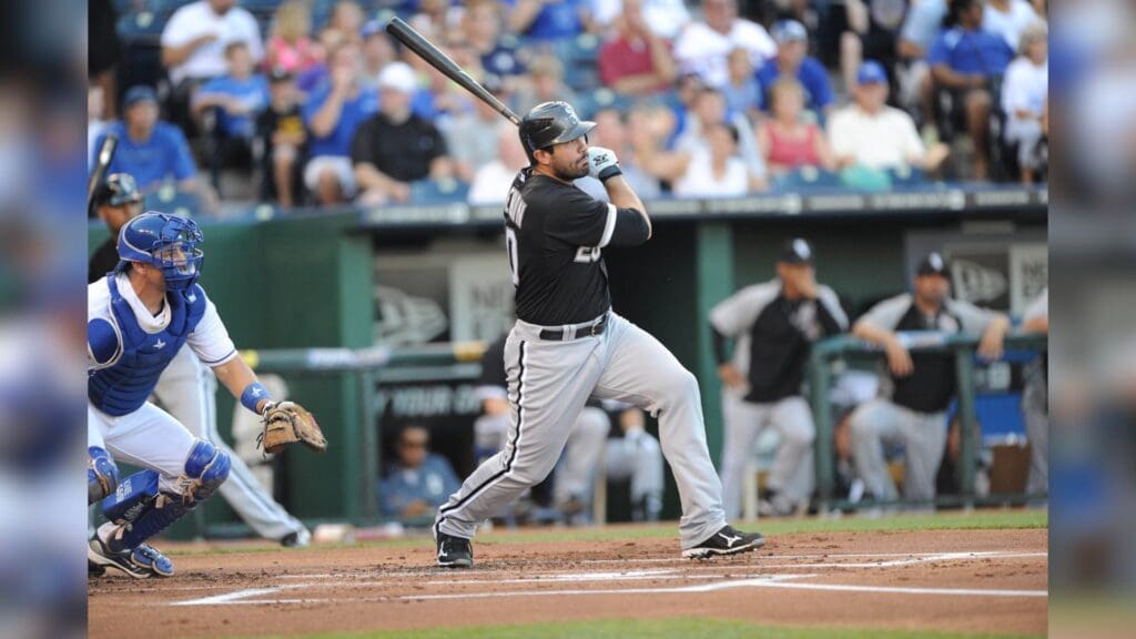 July 19, 2011; Kansas City, MO, USA; Chicago White Sox batter Carlos Quentin (20) hits a RBI single against the Kansas City Royals during the first inning at Kauffman Stadium.
