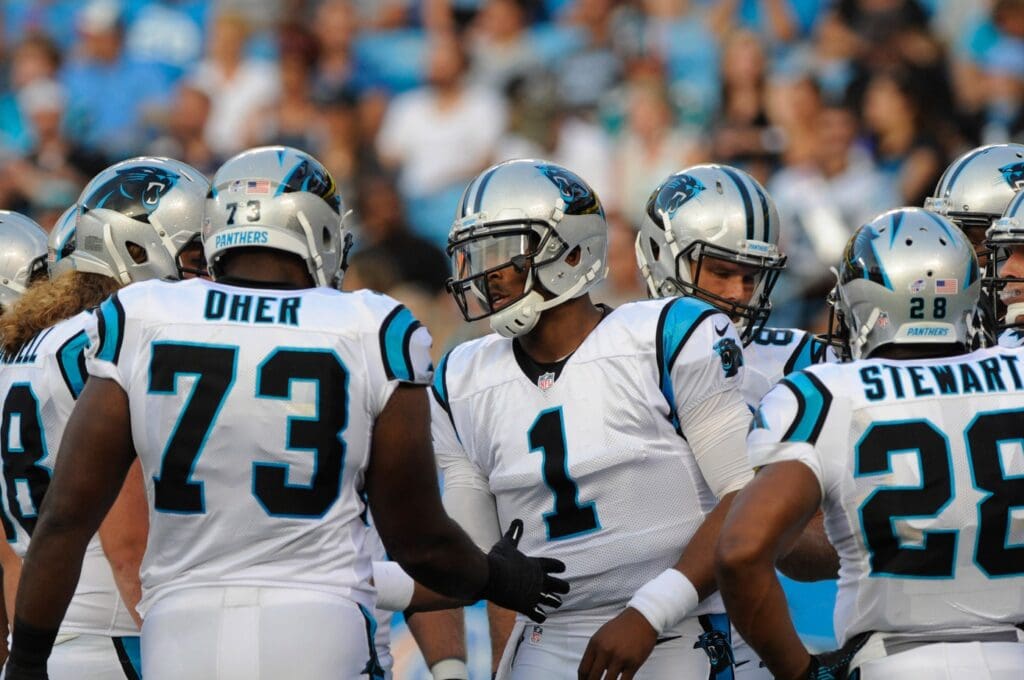 Aug 22, 2015; Charlotte, NC, USA; Carolina Panthers quarterback Cam Newton (1) comes out to his team for the first set of downs during the first half of the game at Bank of America Stadium.