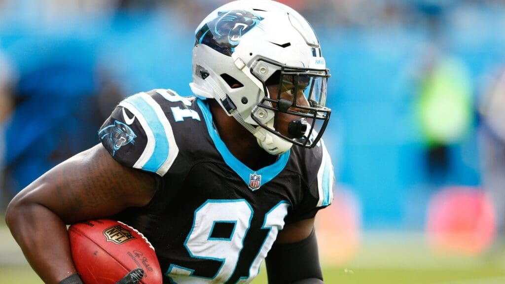 Dec 24, 2017; Charlotte, NC, USA; Carolina Panthers defensive tackle Bryan Cox (91) returns a kickoff in the third quarter against the Tampa Bay Buccaneers at Bank of America Stadium.