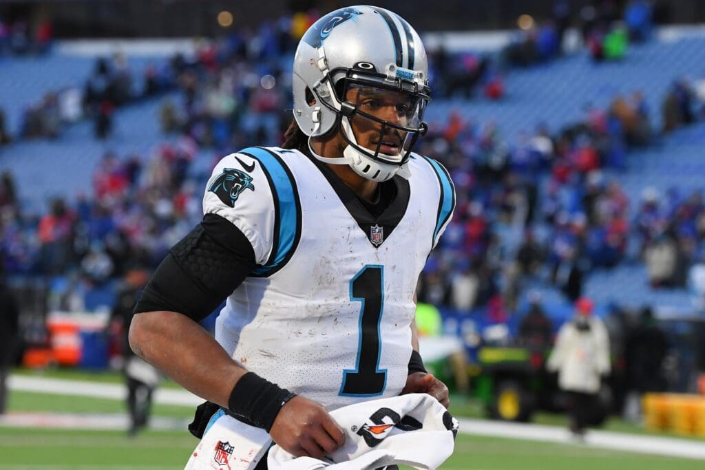 Dec 19, 2021; Orchard Park, New York, USA; Carolina Panthers quarterback Cam Newton (1) jogs off the field following the game against the Buffalo Bills at Highmark Stadium. Mandatory