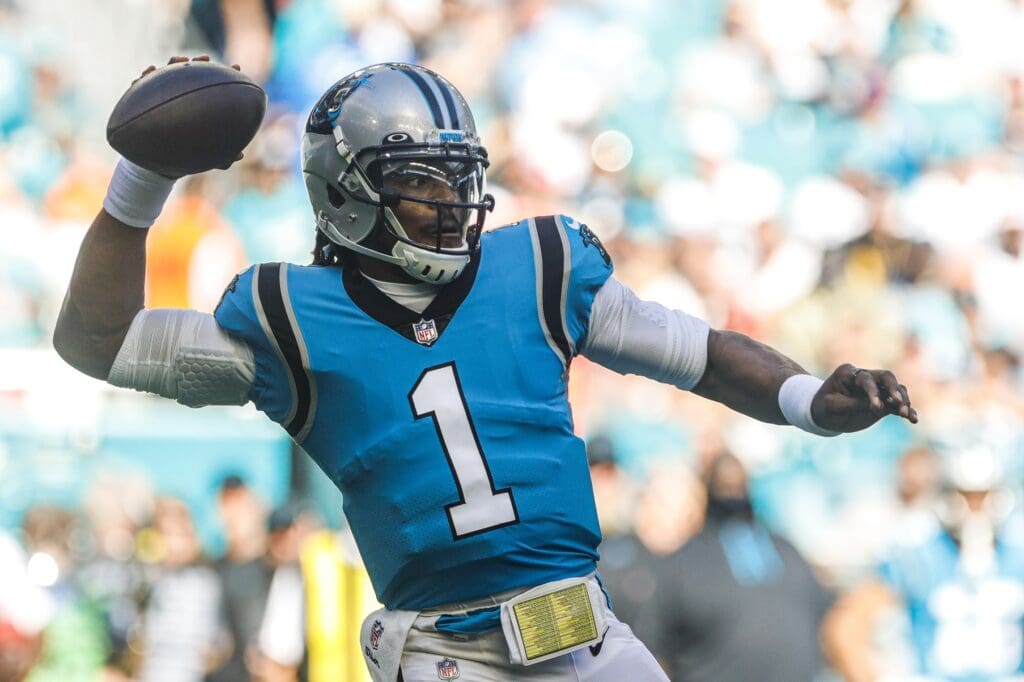 Nov 28, 2021; Miami Gardens, Florida, USA; Carolina Panthers quarterback Cam Newton (1) throws the football against the Miami Dolphins during the firs period at Hard Rock Stadium.