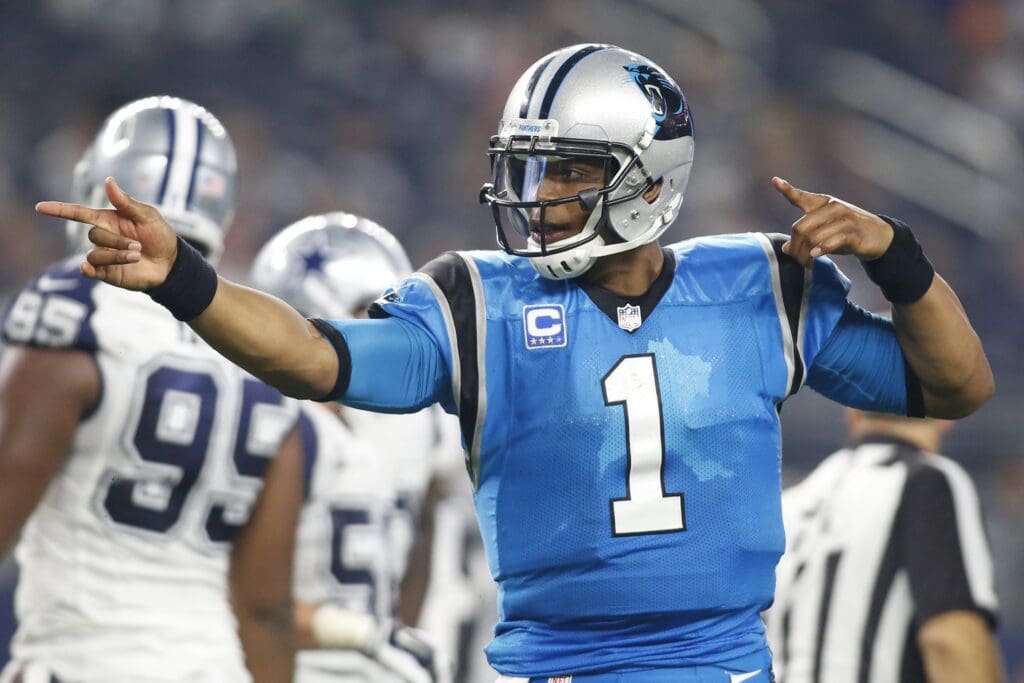 Nov 26, 2015; Arlington, TX, USA; Carolina Panthers quarterback Cam Newton (1) signals for a first down against the Dallas Cowboys during the fourth quarter of a NFL game on Thanksgiving at AT&T Stadium. Carolina won 33-14.