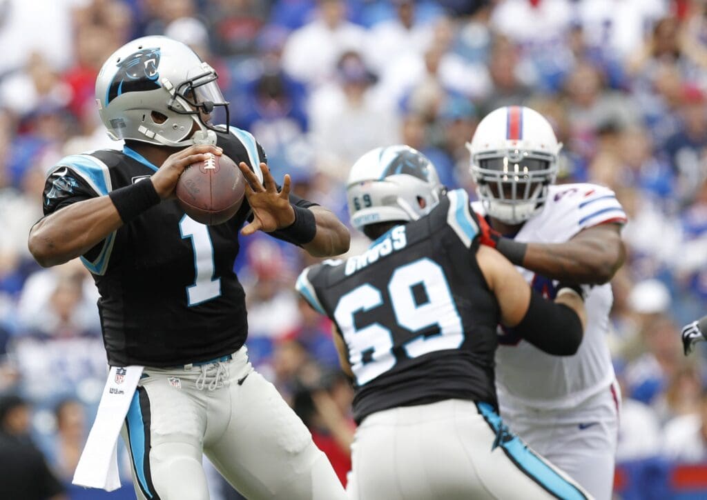 Sep 15, 2013; Orchard Park, NY, USA; Carolina Panthers quarterback Cam Newton (1) passes during the first half against the Buffalo Bills at Ralph Wilson Stadium. Buffalo beat Carolina 27-26. 