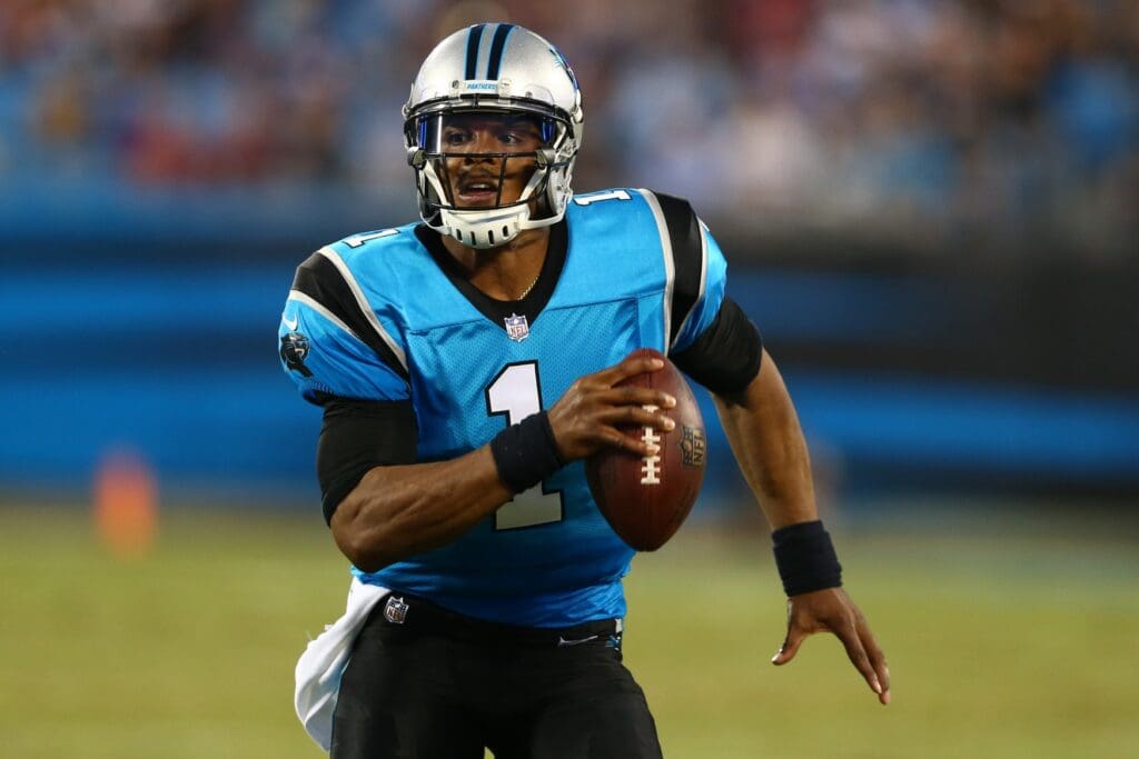 Aug 24, 2018; Charlotte, NC, USA; Carolina Panthers quarterback Cam Newton (1) runs the ball in the first quarter against the New England Patriots at Bank of America Stadium.