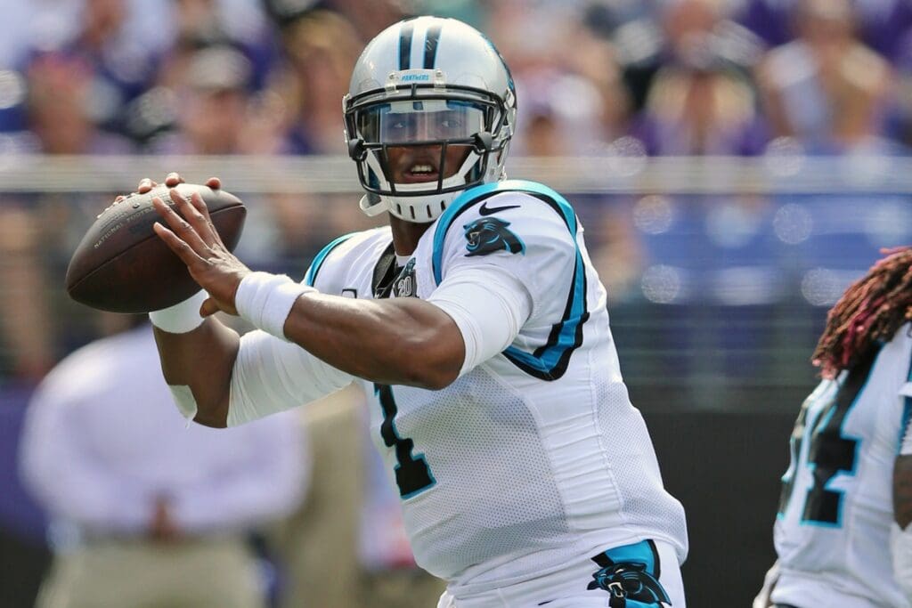 Sep 28, 2014; Baltimore, MD, USA; Carolina Panthers quarterback Cam Newton (1) throws the ball against the Baltimore Ravens at M&T Bank Stadium.
