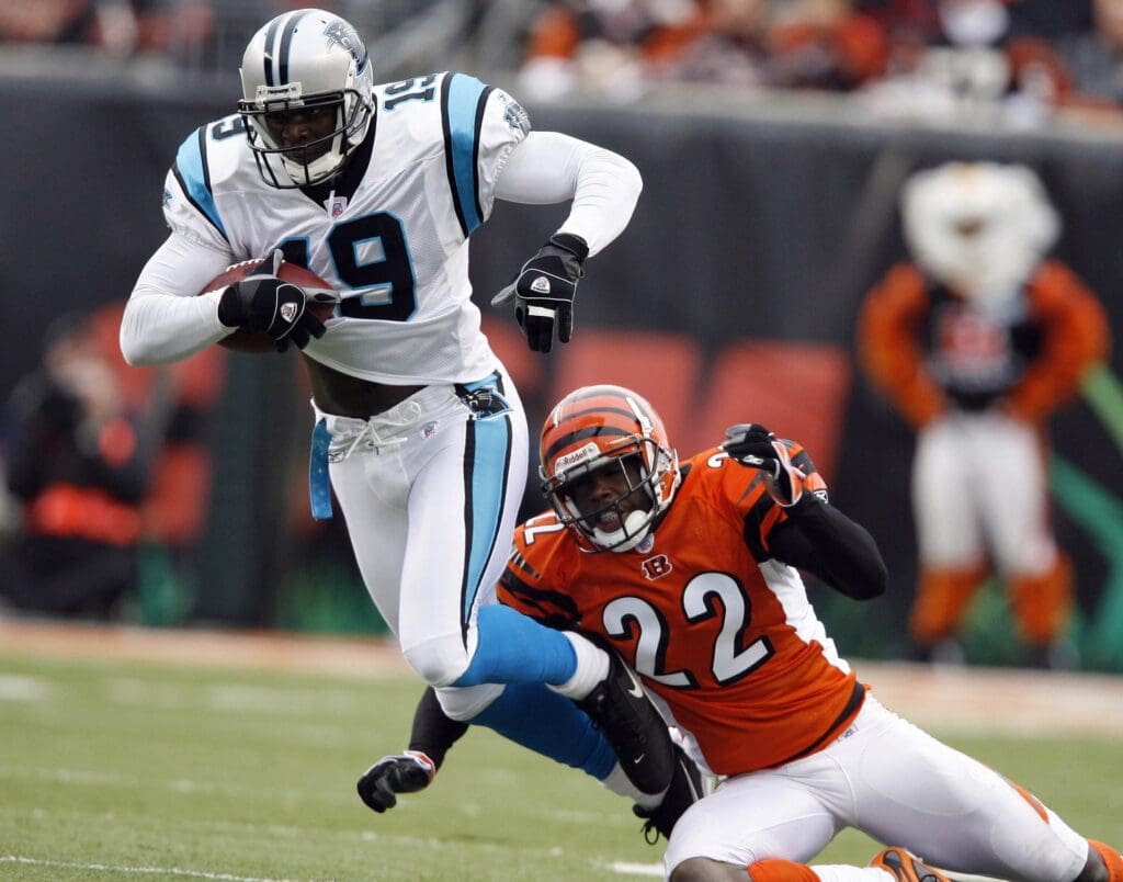 Oct 22, 2006; Cincinnati, OH, USA; Carolina Panthers receiver (19) Keyshawn Johnson runs after a catch against Cincinnati Bengals cornerback (22) Johnathan Joseph at Paul Brown Stadium.